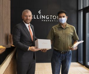 Pictured is Elie Naaman, Co-Founder and CEO of Ellington Properties, with a Harrington House homeowner.